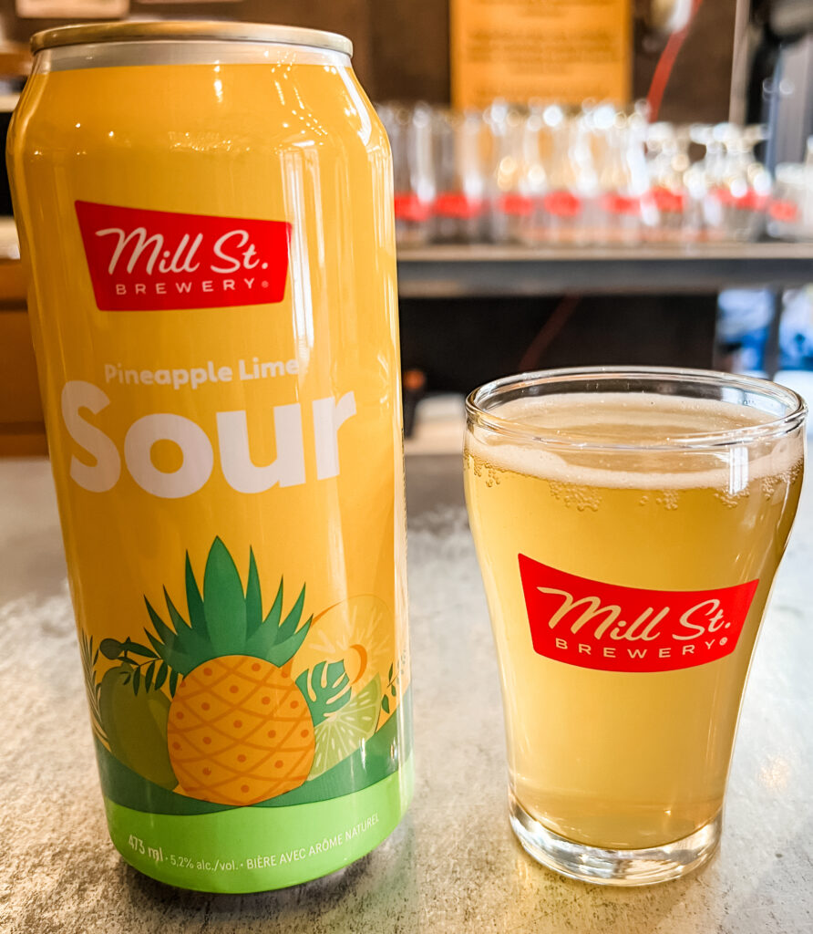 Can and sample of the Mill St. Brewery pineapple lime sour beer.